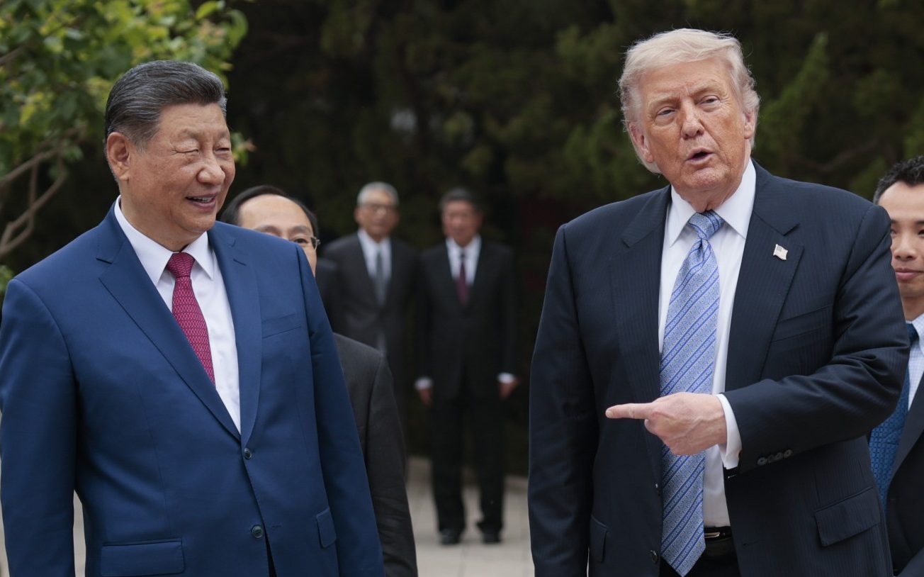 President Donald Trump gestures towards Chinese President Xi Jinping