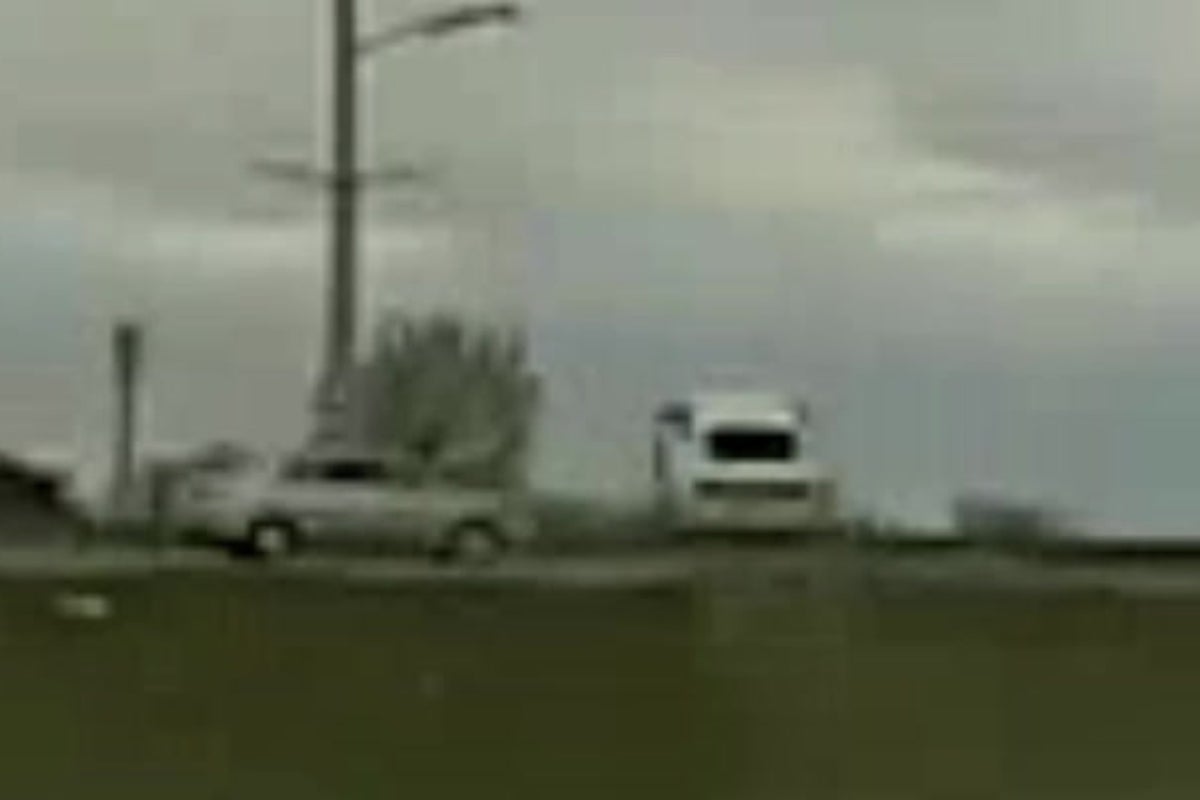 Wild moment car flies over another vehicle while fleeing police