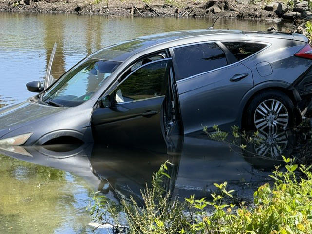 Norfolk crash ends with car in water, other driver in custody