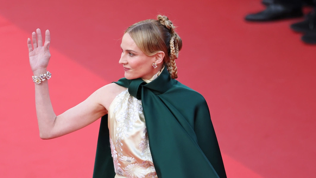 Diane Kruger turns heads with cape defying Cannes rules
