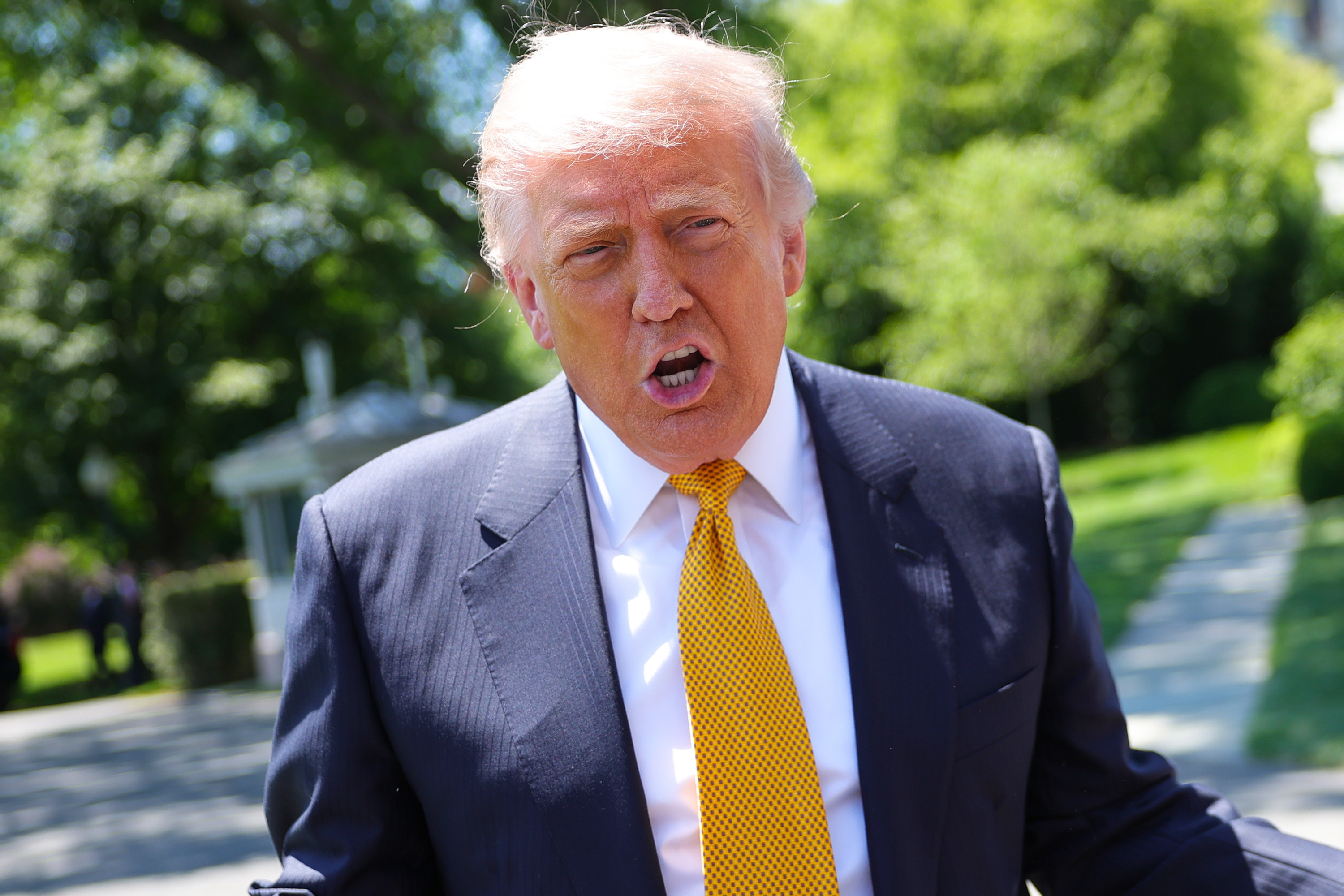 President Donald Trump speaks to the press as he departs the White House on May 12, 2026 in Washington, DC.