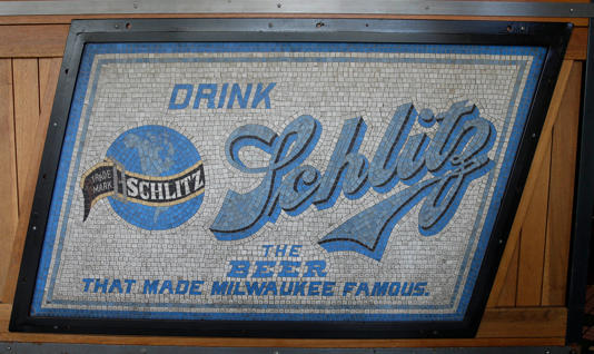 An early ceramic mosaic of Schlitz is featured at the entrance to Water Street Brewery where owner R.C. Schmidt has been collecting beer memorabilia since 1987. The items are displayed throughout the bar.