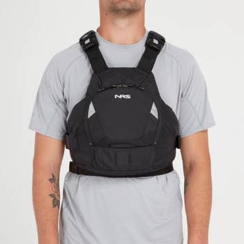 model wearing the lifejacket in black showing a front zippered pocket