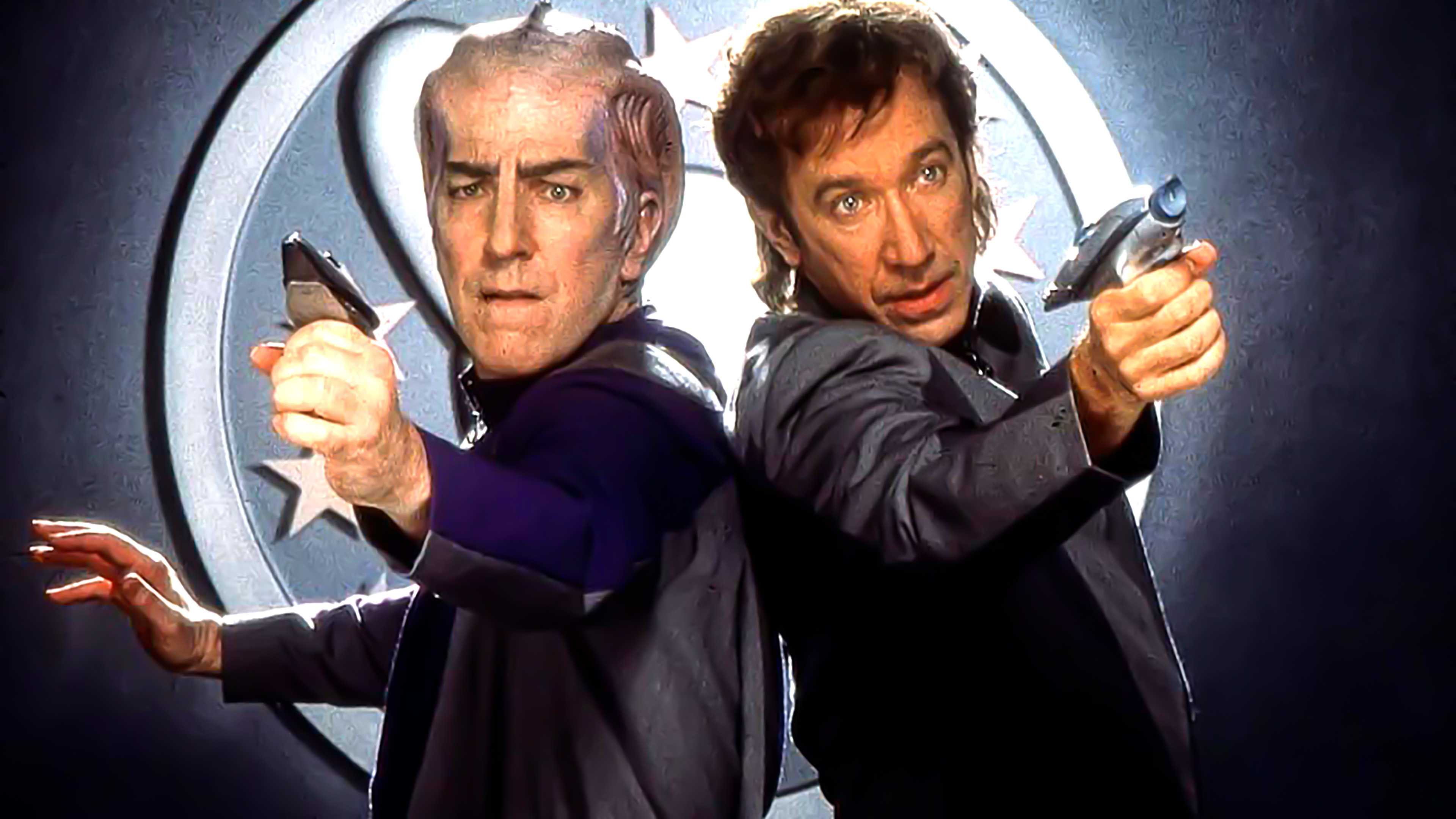 Alan Rickman's Alexander and Tim Allen's Jason posing for photos for Galaxy Quest