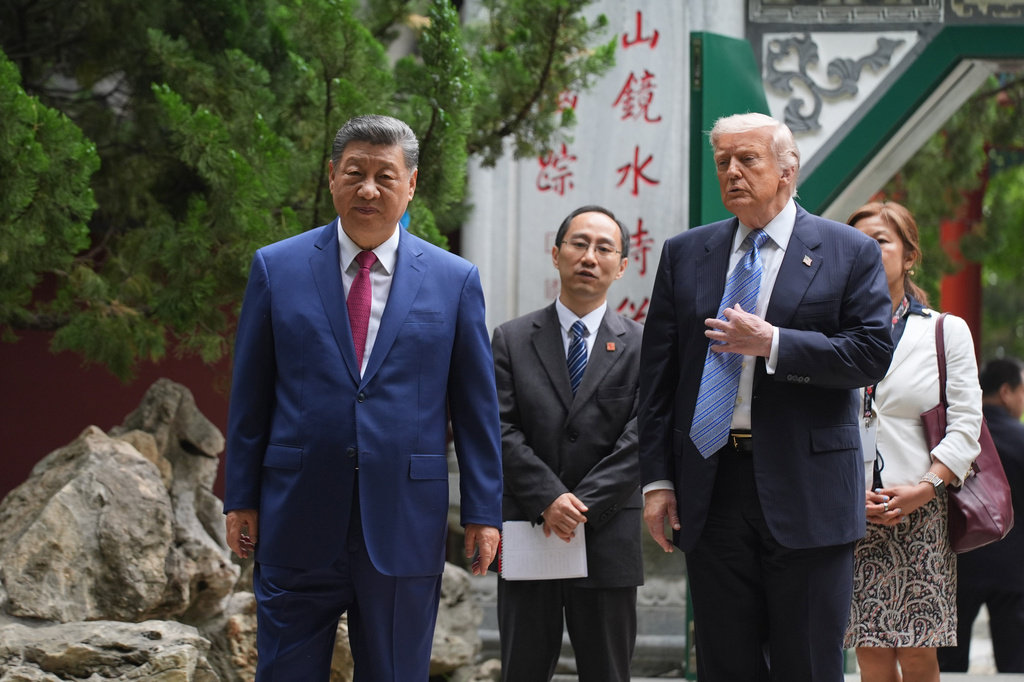 The latest: After China visit, Trump says he’s undecided on sending ...