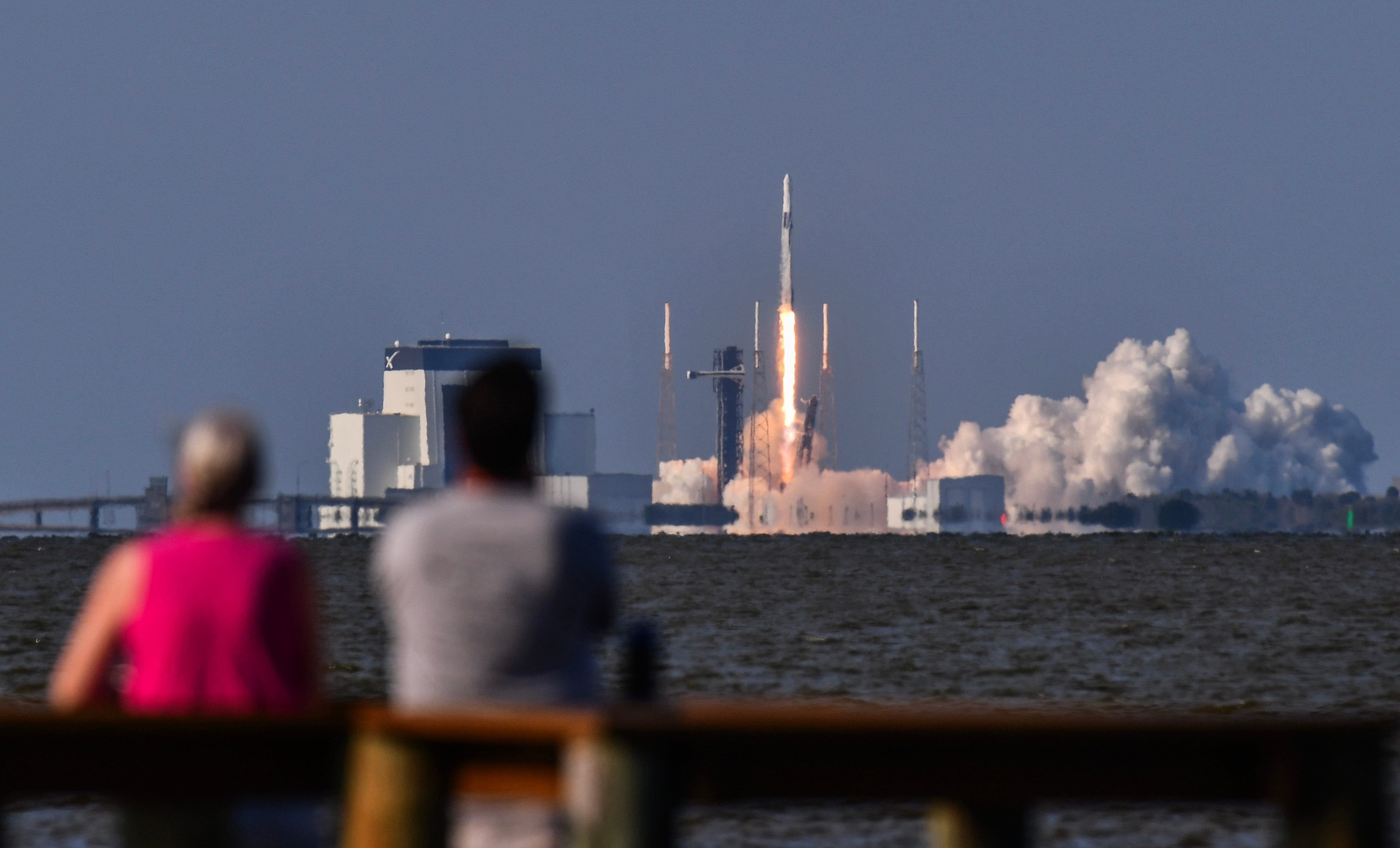 ˆLaunch of a SpaceX Falcon 9 rocket launching a Dragon spacecraft packed with supplies and equipment to the International Space Station. The rocket launched at 6:05 p.m. from Launch Complex 40 at Cape Canaveral Space Force Station on Friday, May 15. People at KARS Park watch the launch.