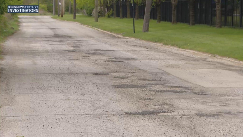 Pothole-filled street in Pullman gets partial temporary patch job ...