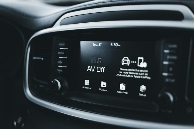 a close up of a radio in a car