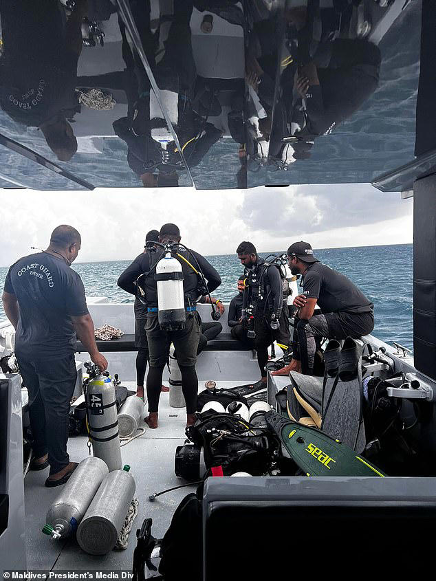 This photograph shared by the Maldives President's Media Division, shows divers preparing to search for the four missing Italian divers near Alimathaa Island, Vaavu Atoll, Maldives, Saturday, May 16, 2026