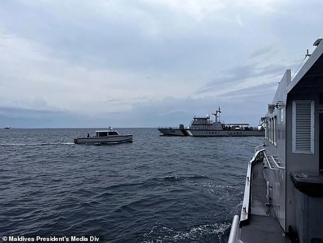 This image released by the Maldives President's Media Division, shows a coast guard boat and other vessels deployed to search for the four missing Italian divers near Alimathaa Island, Vaavu Atoll