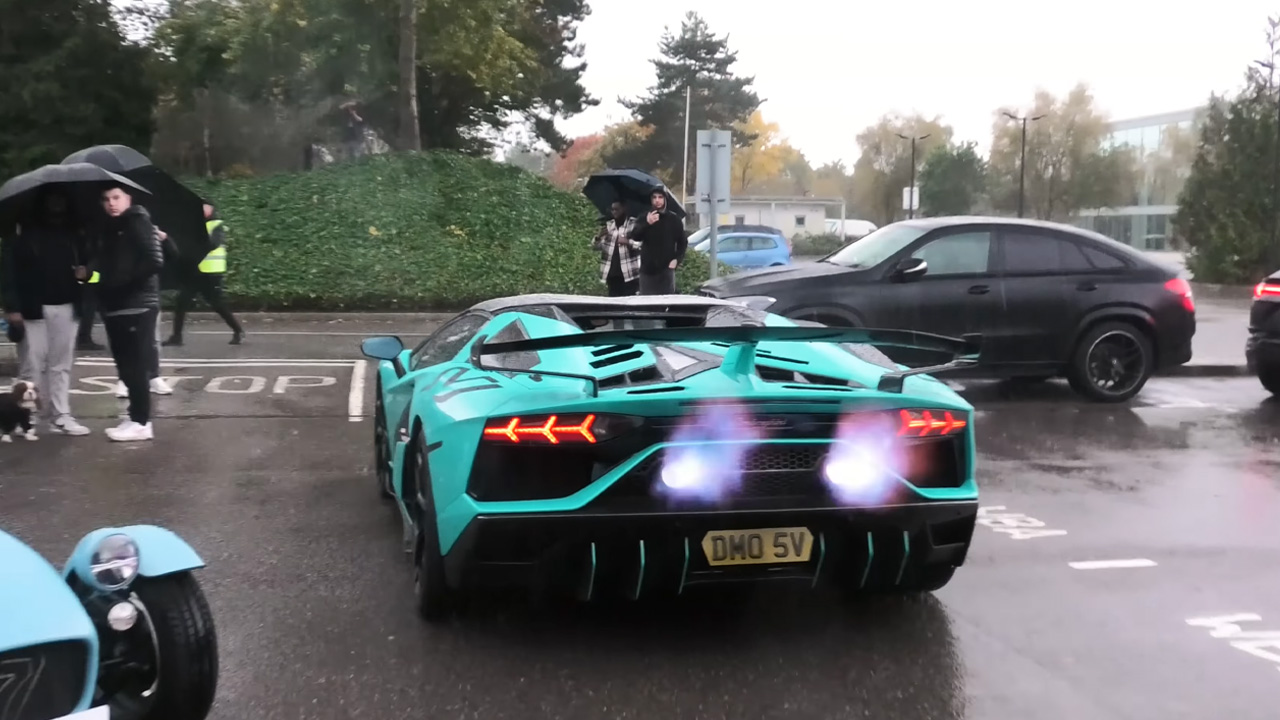 Extreme supercar rev battle and flame spitting in the rain