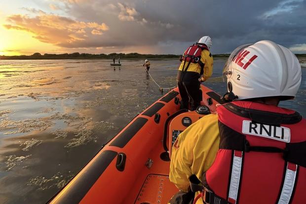 Two boys on rowing boat saved in 'challenging' marsh rescue