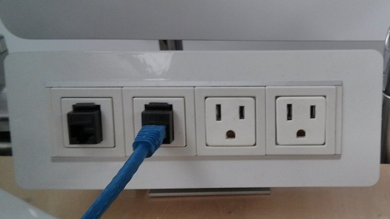 Why some electrical plugs have two prongs (and others have three)
