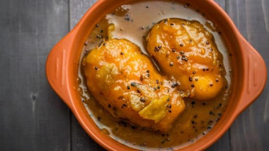 Gujarati keri no ras with fresh raw mango and balanced sweet tangy flavour