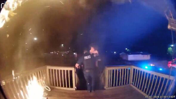 Moment hero cop runs into burning building to save kids and mom