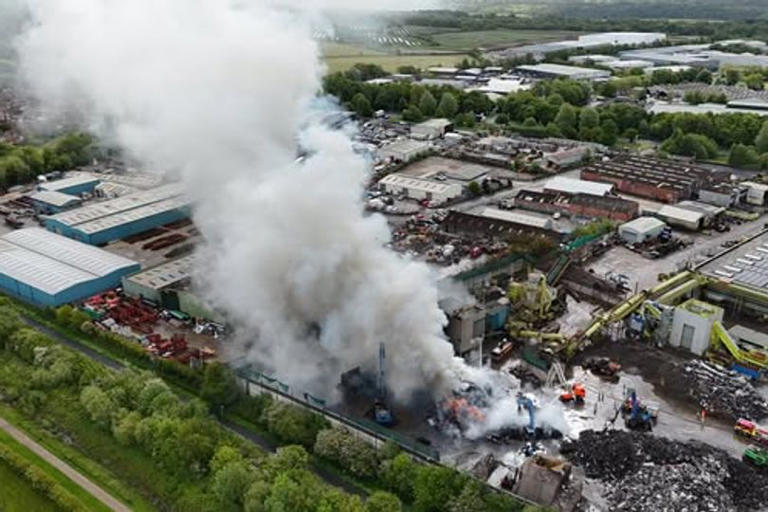 Watch as fire crews tackle ongoing blaze at recycling centre