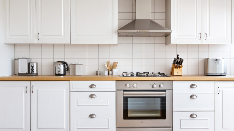 The vinyl tile solution to keep moisture from seeping into wood cabinets