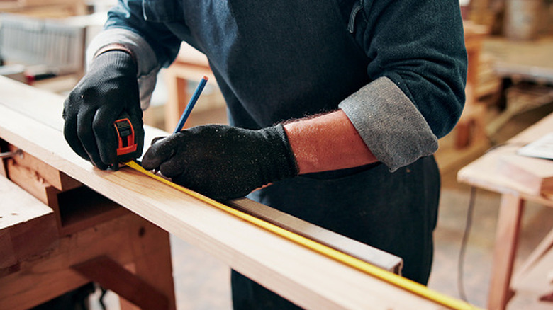 Why do tape measures have those little black diamonds? Here's what they ...