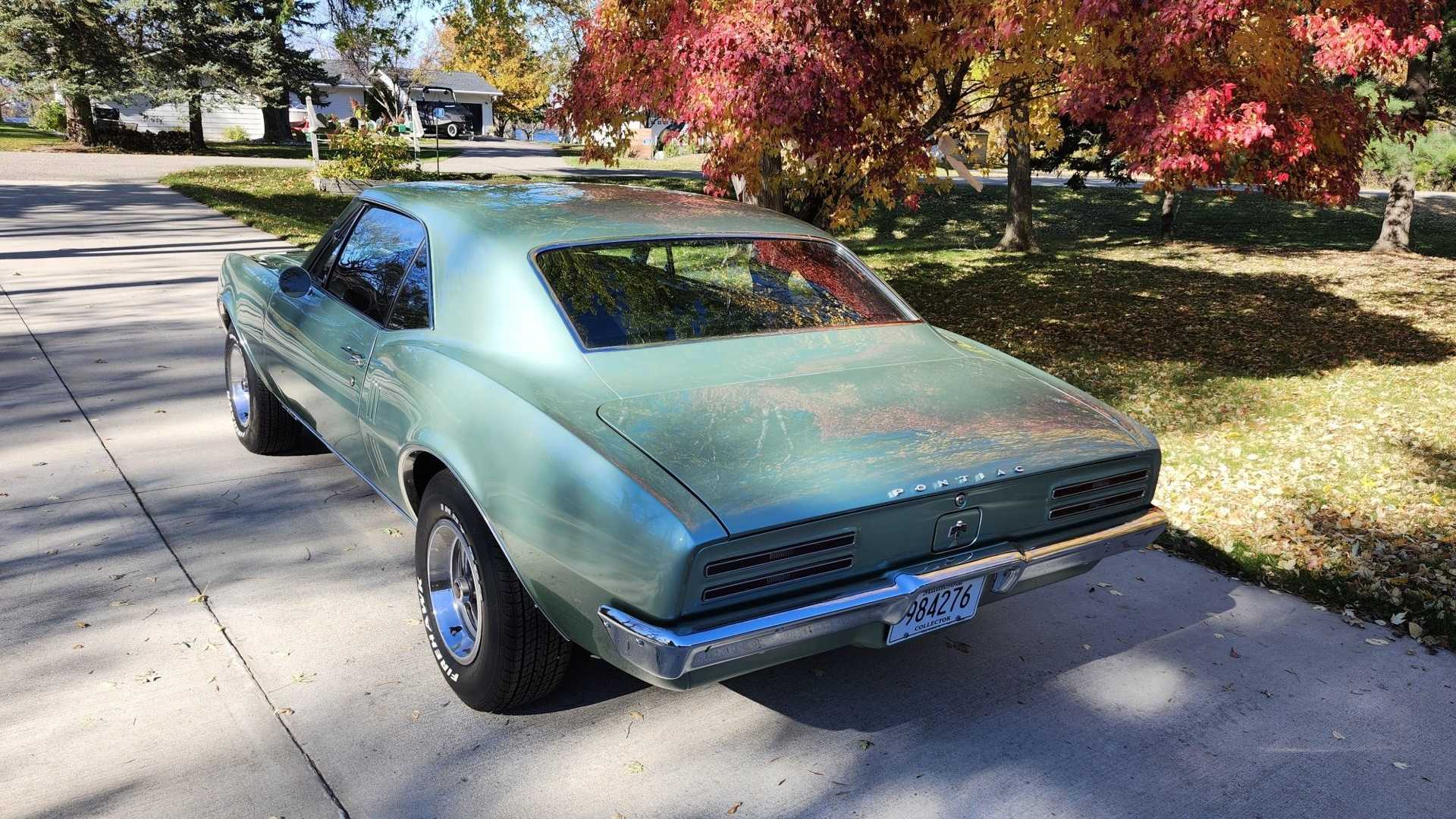 Rear of a Pontiac muscle car, parked in a driveway