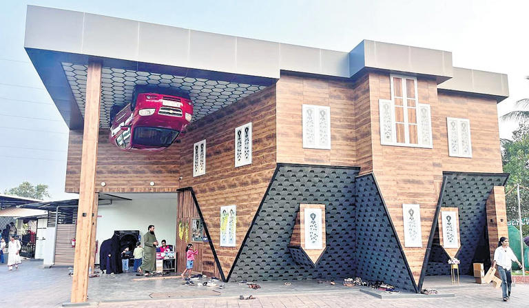 At home with illusions! Kayalode upside-down house a major draw