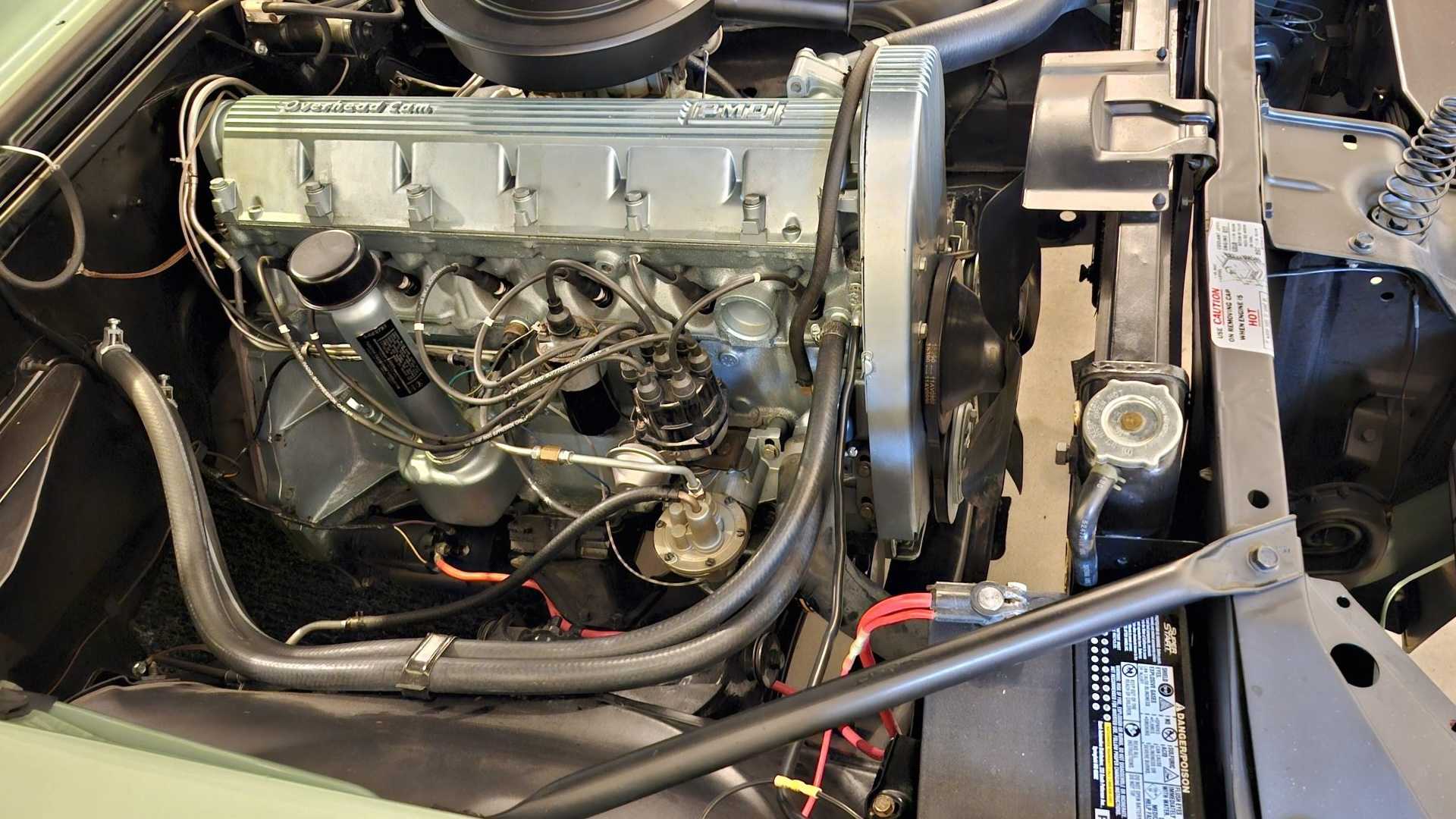 The engine bay of a classic Pontiac muscle car