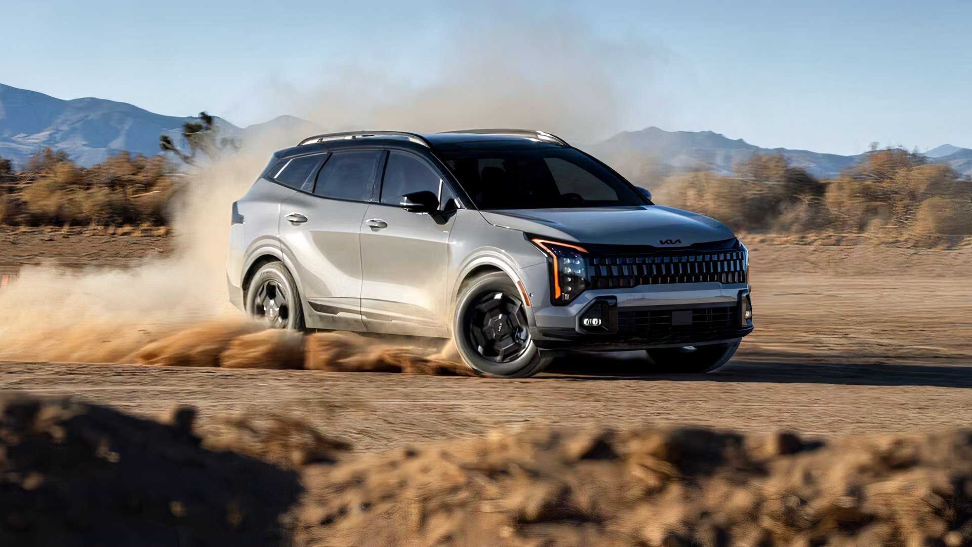 Front shot of a 2026 Kia Sportage Hybrid kicking up dust Off-Road