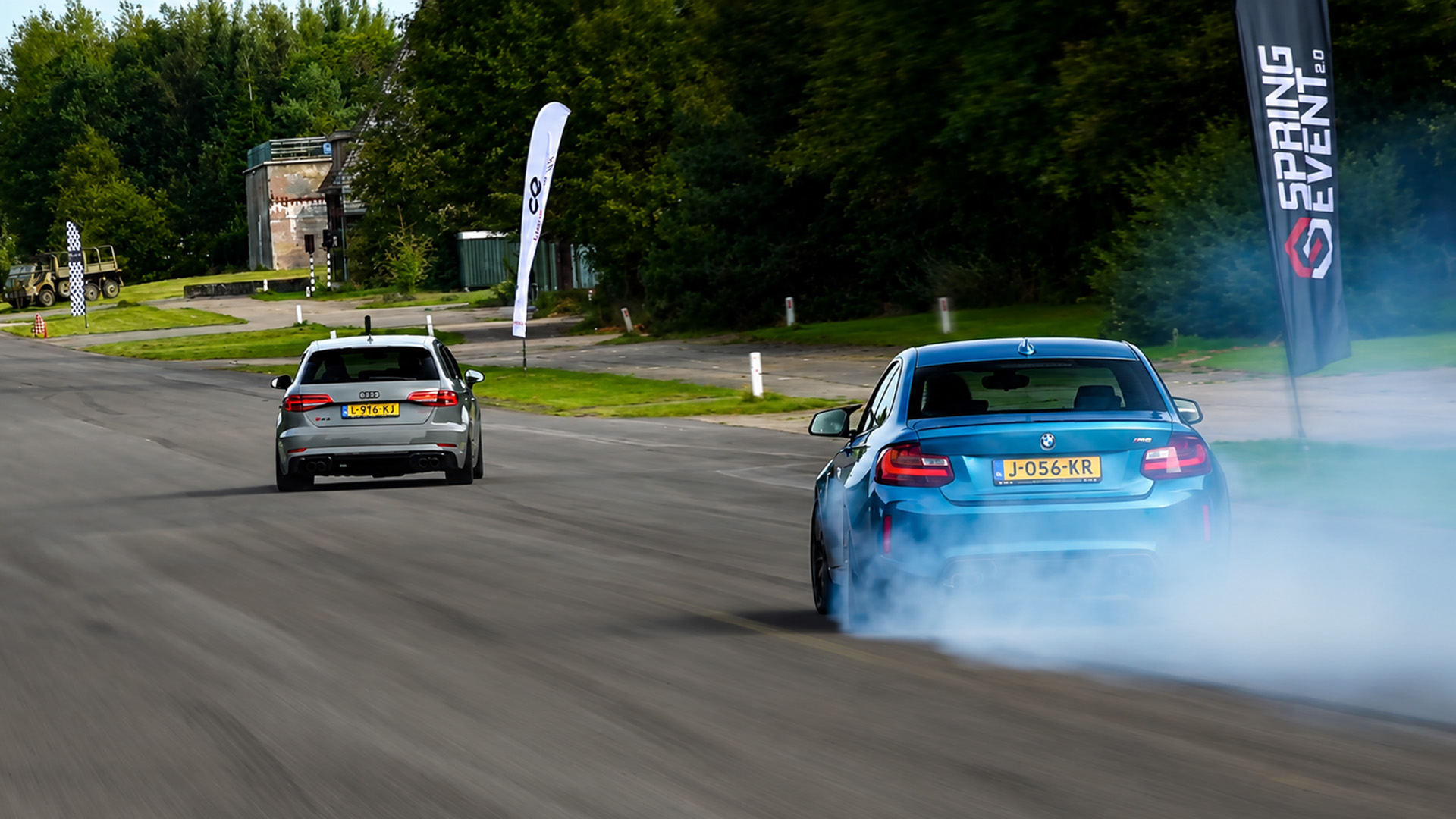 Audi RS3 loses control during drag race with BMW M2