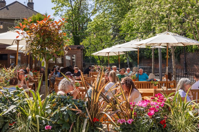 Pub overlooking idyllic village ponds on edge of Surrey reopens in ...