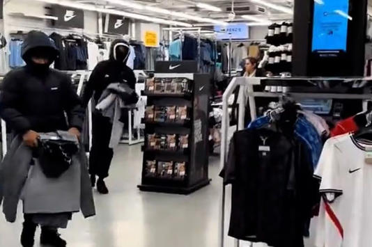 Footage shows the moment hooded thugs raided a JD Sports shop