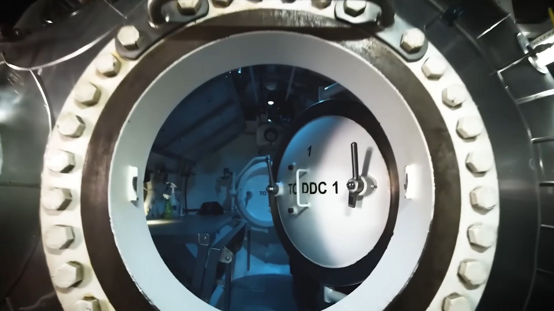 Watch a sinking barge trap four divers as the hatch stays sealed