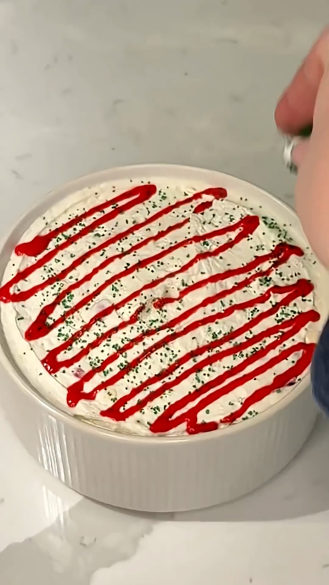 Festive cake batter dip shaped into tree form with decorations