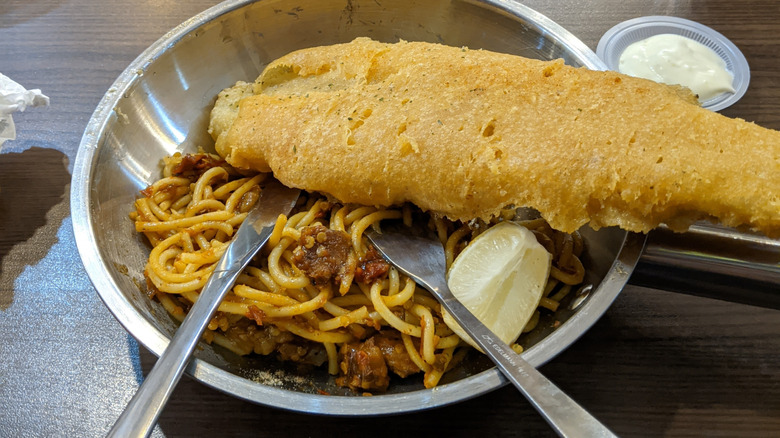How the tradition of fried fish and spaghetti made its way from the ...