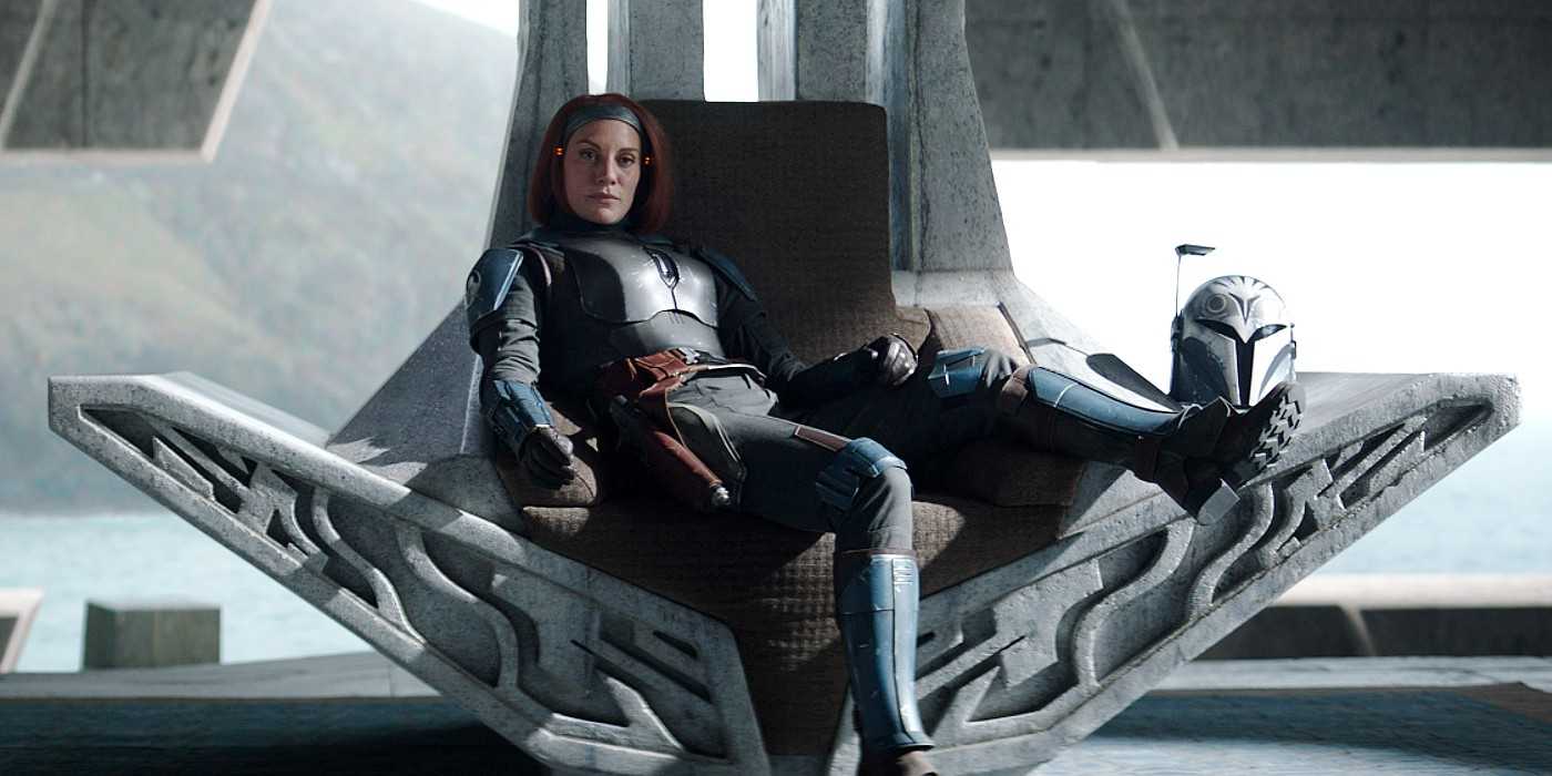 Bo-Katan, played by Katee Sackhoff, lounging on a throne with her helmet off in The Mandalorian