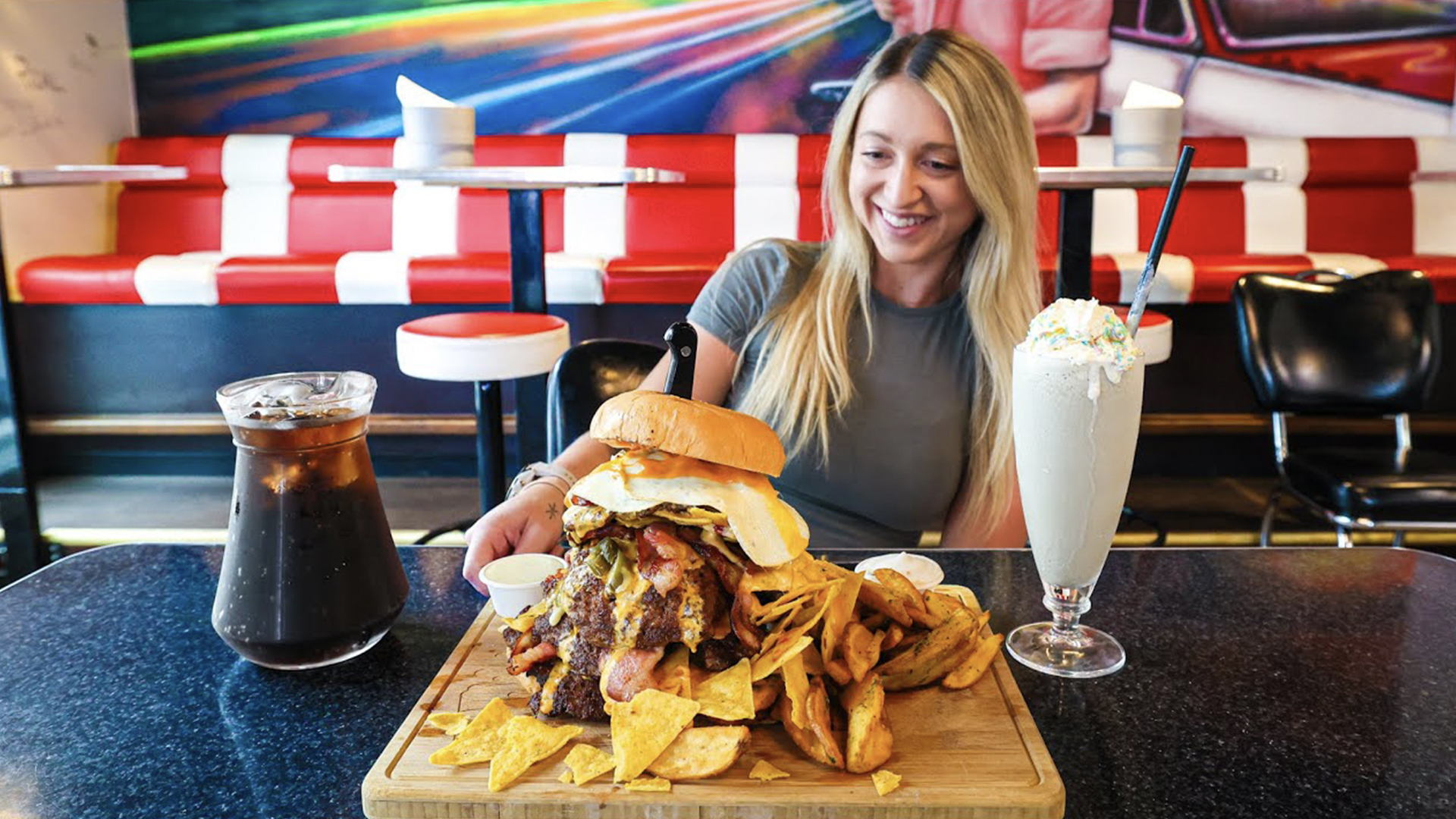 Girl tries to finish massive nacho cheeseburger challenge