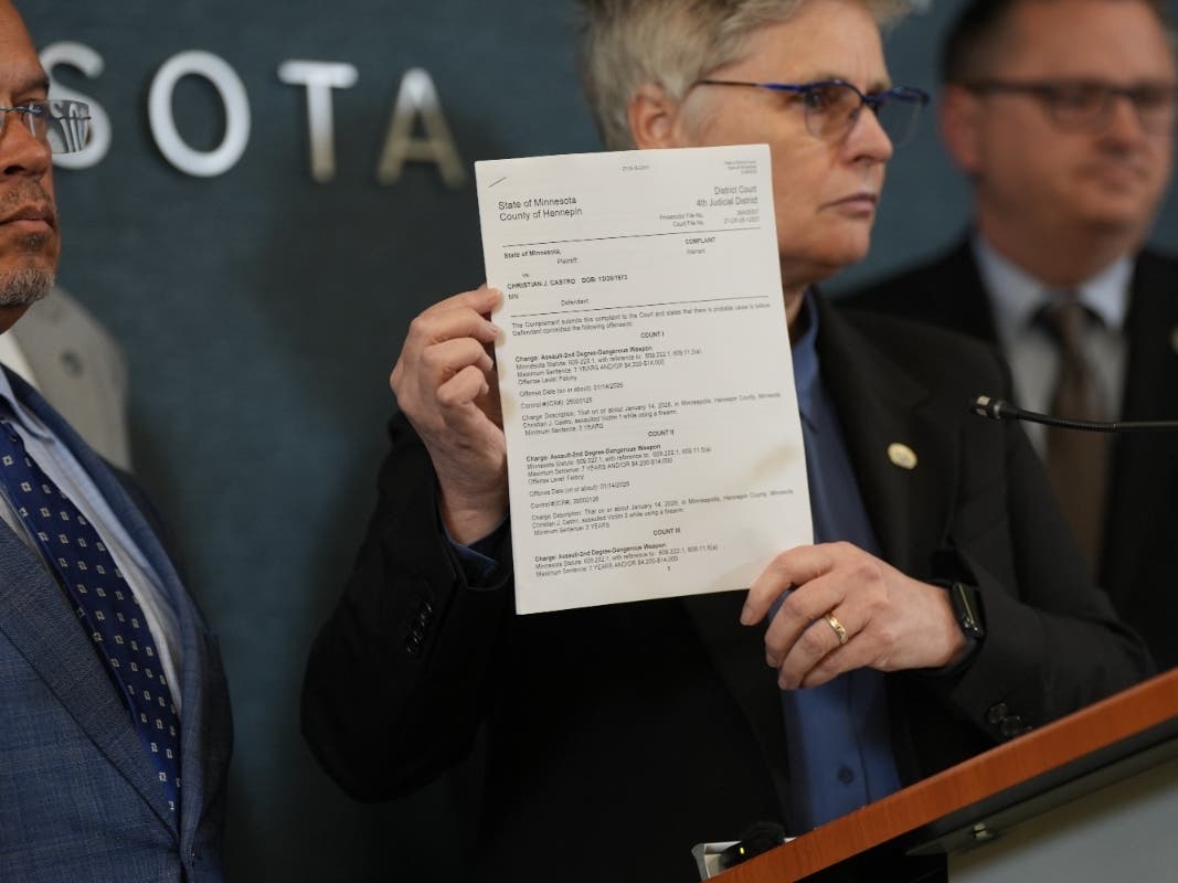 ICE agent charged in MN shooting, nationwide warrant issued