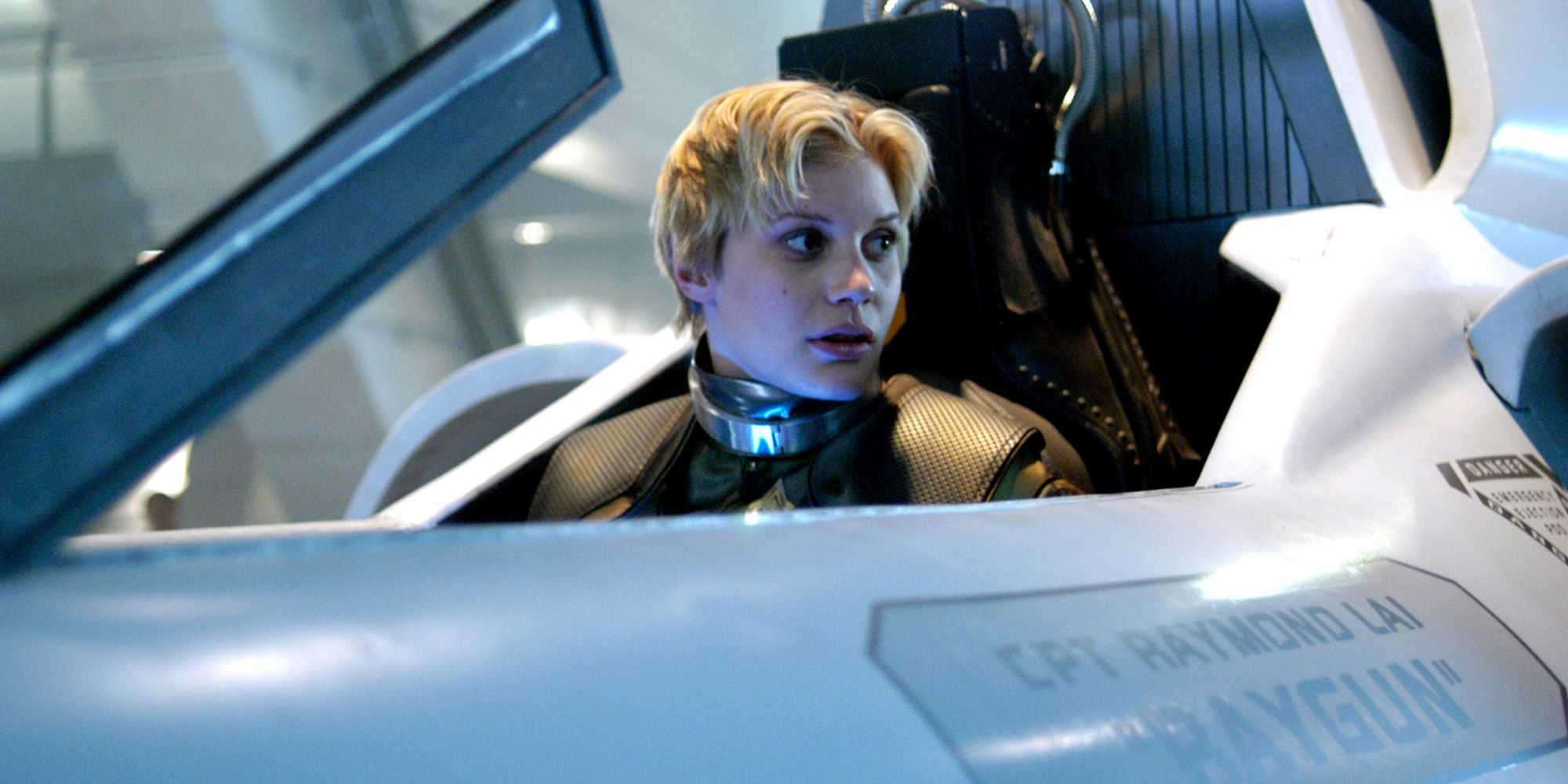 Katee Sackhoff as Kara 'Starbuck' Thrace in a cockpit in Battlestar Galactica.