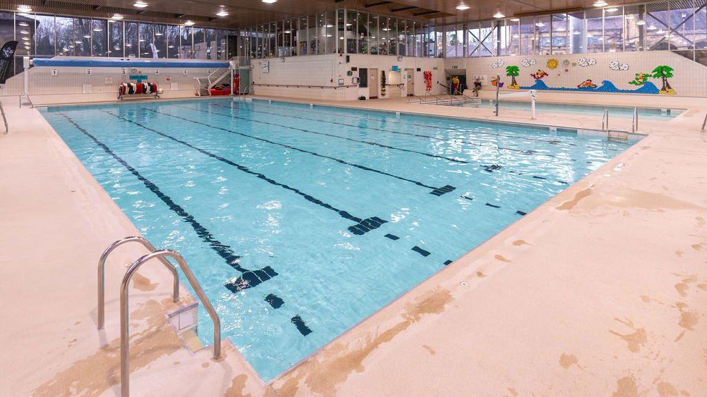Swimming pool building repair costs over budget