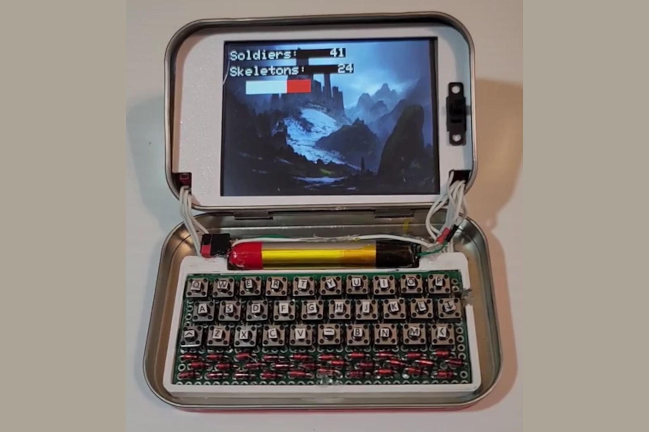 This Altoids tin ESP32 computer comes with a keyboard, and yes, it runs ...