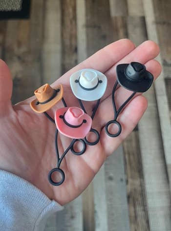 Cowboy hat straw toppers in white, pink, brown, and black
