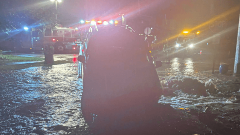 Major flooding hits local roadway after van crashes, shears fire hydrant