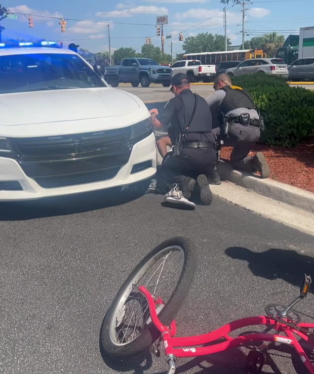 Law enforcement forcefully detained cyclist who was hit by car moments before: 'This is not right'