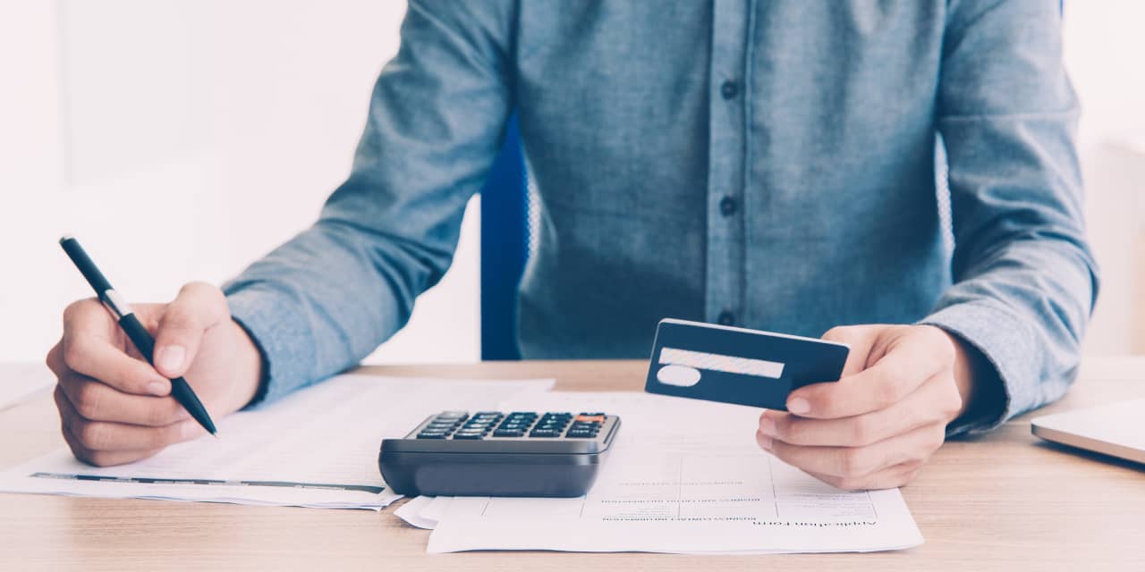 I owe $7K on my credit card at 22% and $6.3K on my car loan at 6.9%. My credit score is 690. What's the smartest strategy for repaying?
