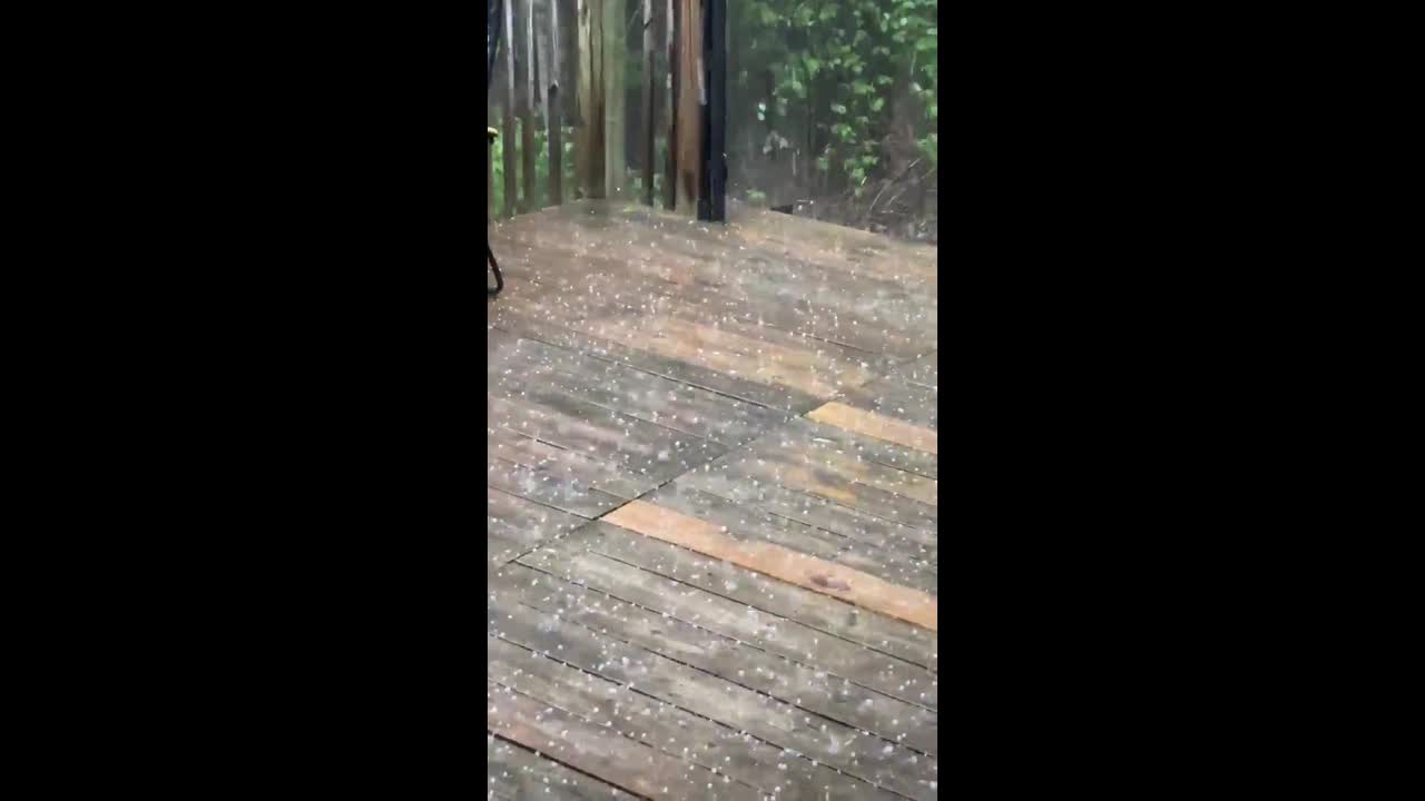 Pea-sized hail blankets patio during storm in Greenbush, Wisconsin, USA