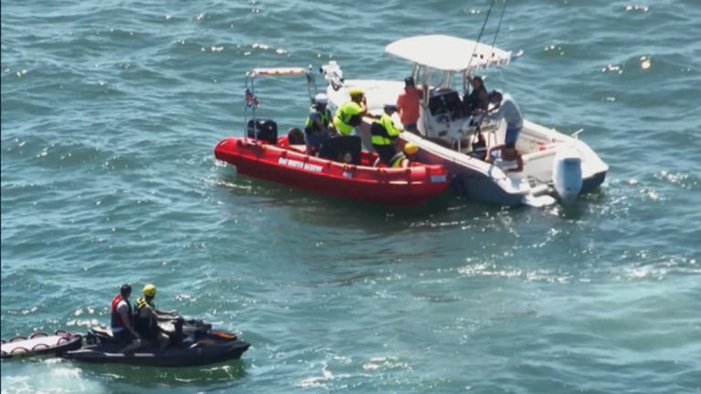 Photos: Four boaters and dog rescued after boat capsizes near Oak Island