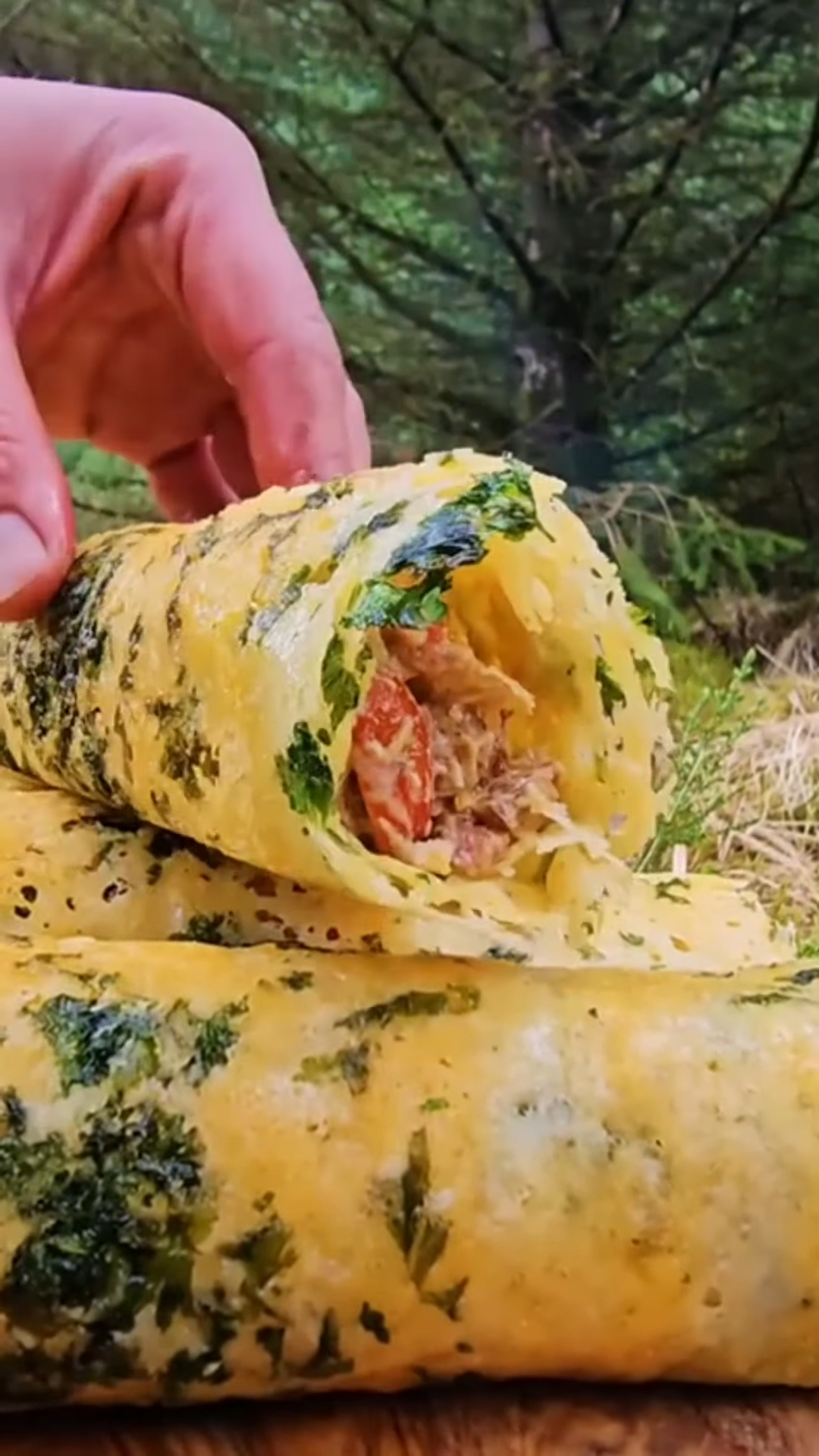 Watch how this chicken wrap turns unbelievably crispy over fire