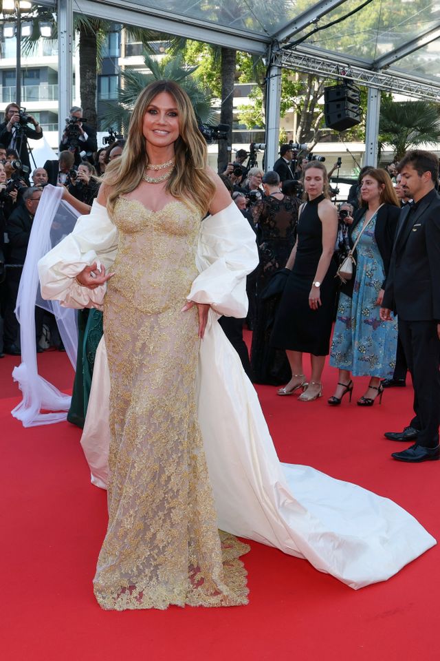 Heidi Klum nearly breaks Cannes dress code in her optical illusion gold  corset and sheer lace look
