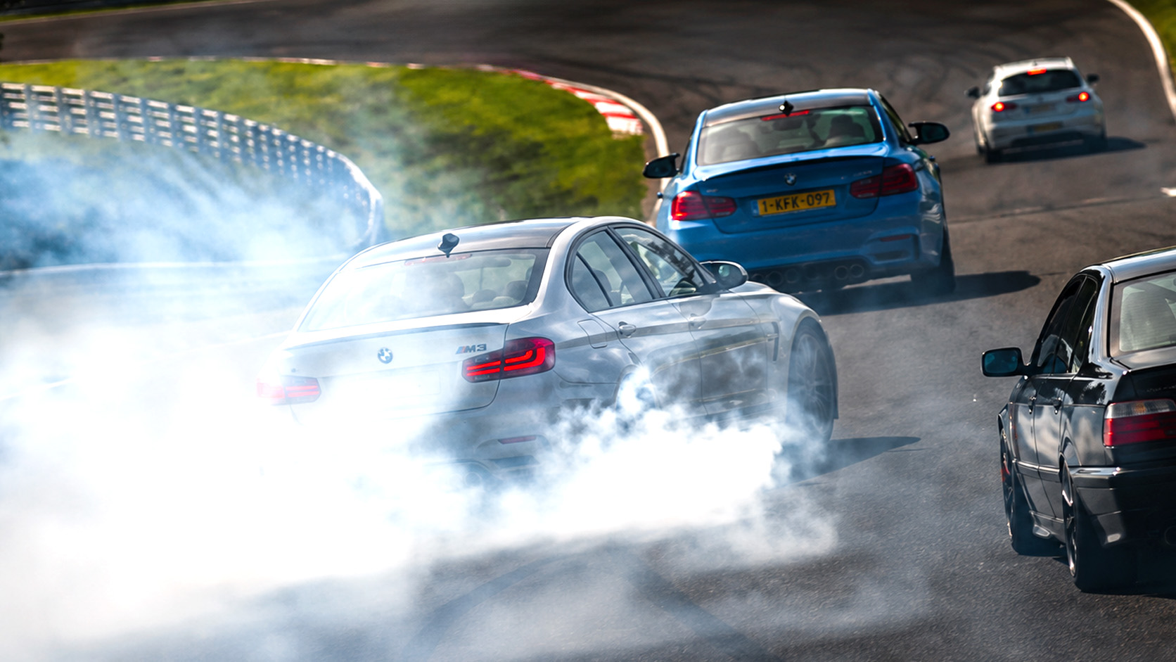 BMW nearly crashes after drifting off track in massive smoke chaos