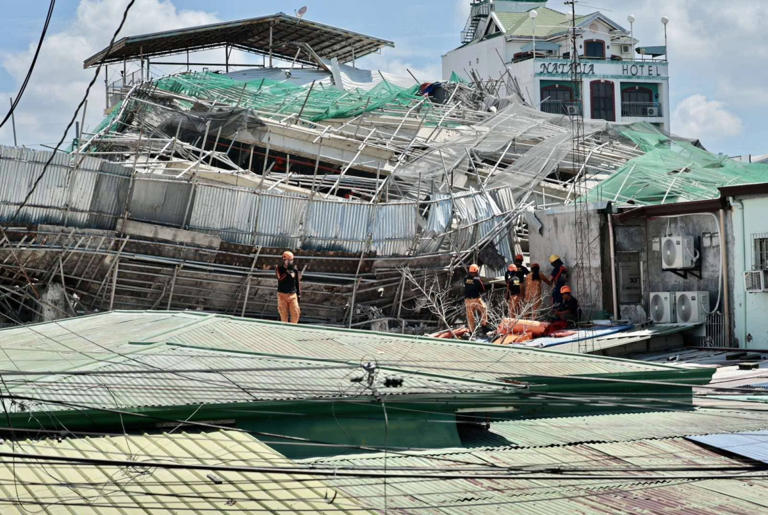 'Signs of life' detected under rubble of collapsed building as search ...