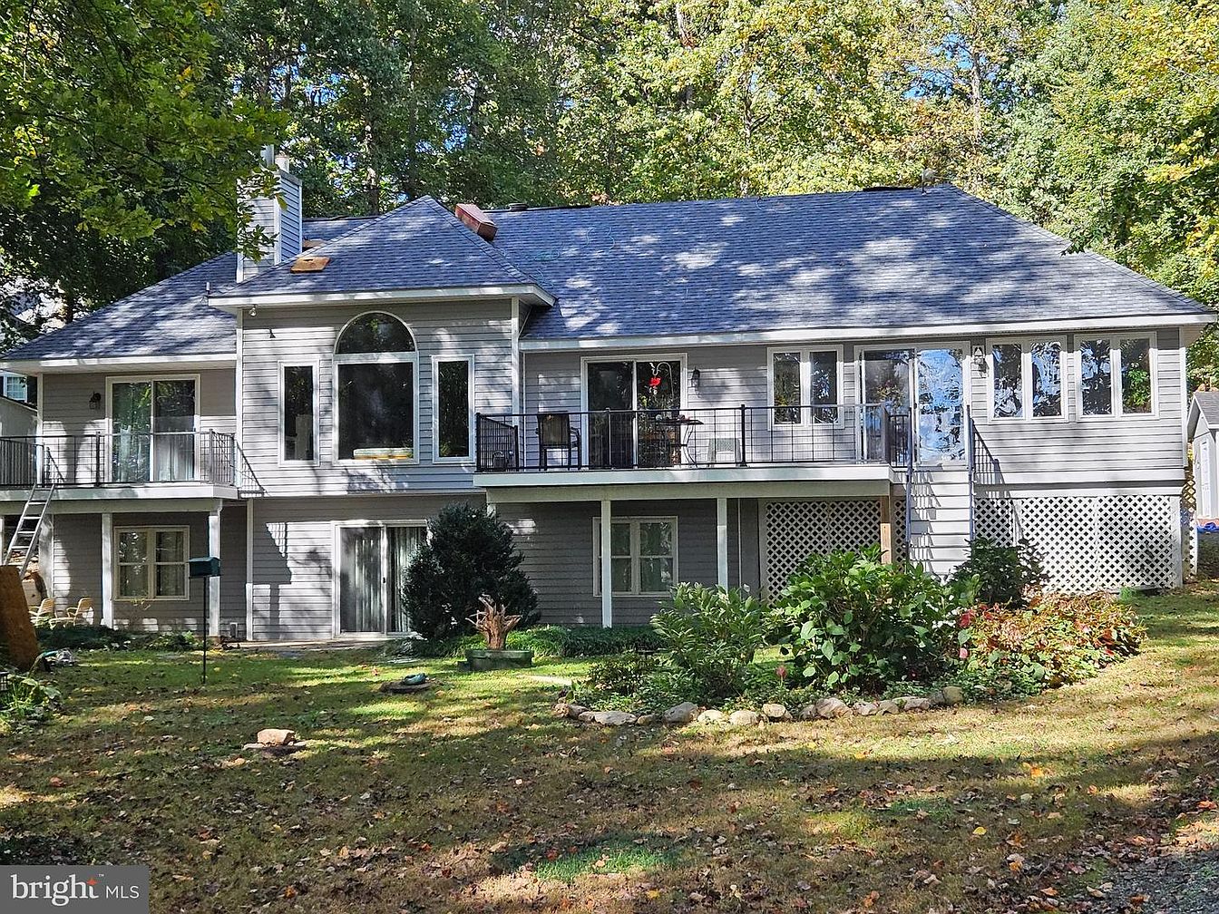 Image showcasing Luxurious 1998 raised ranch in Mineral, Virginia, with private lake access, gourmet kitchen, and ...