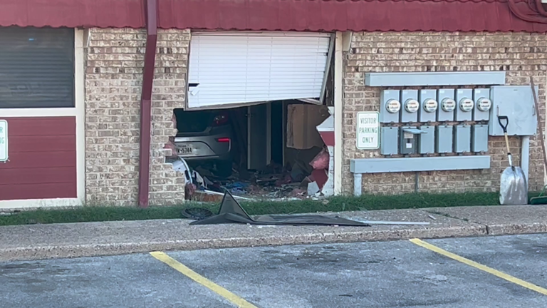 Multiple people injured after vehicle crashes into apartment building